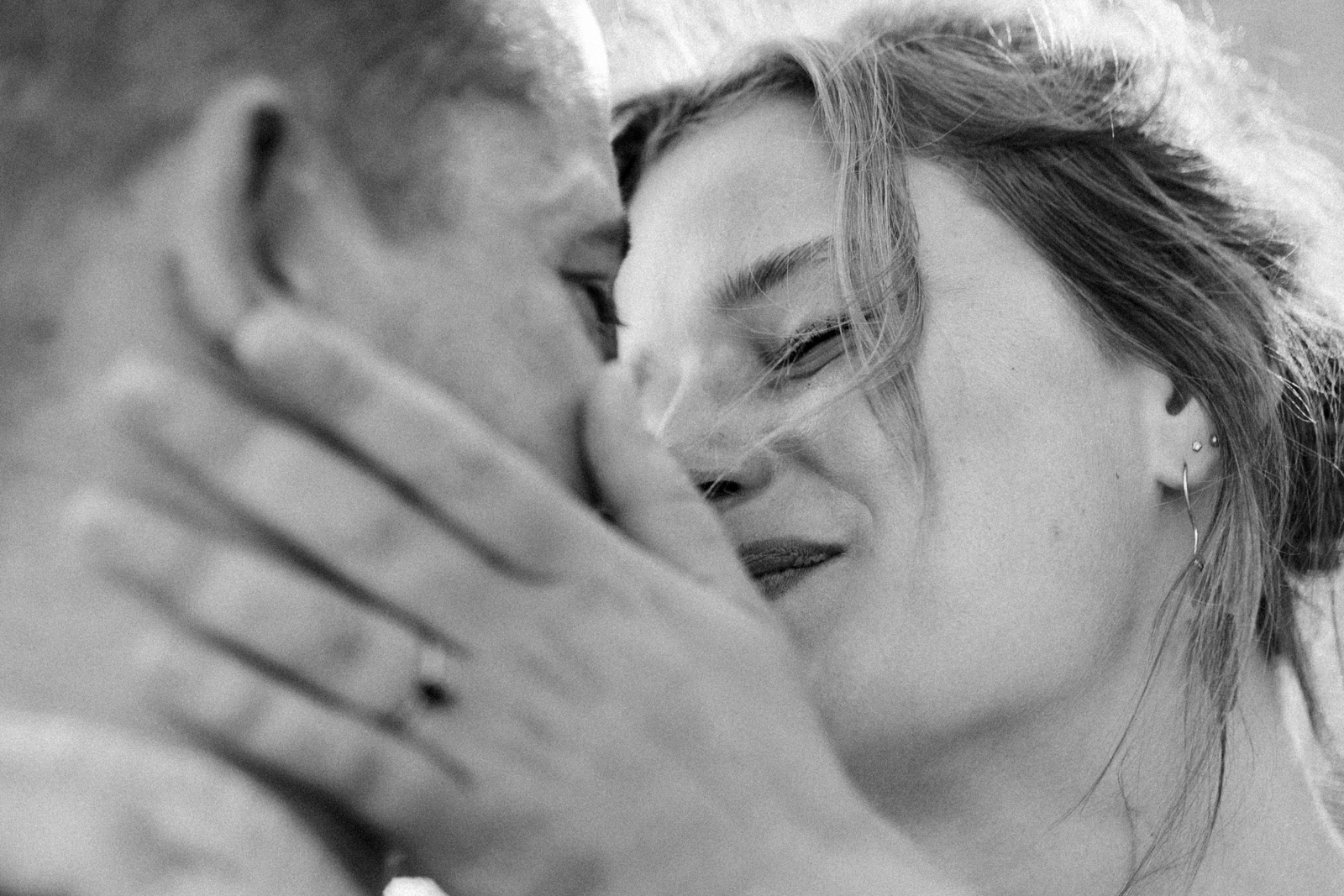 surprise proposal on rocky shoreline in Volosko Croatia at sunset