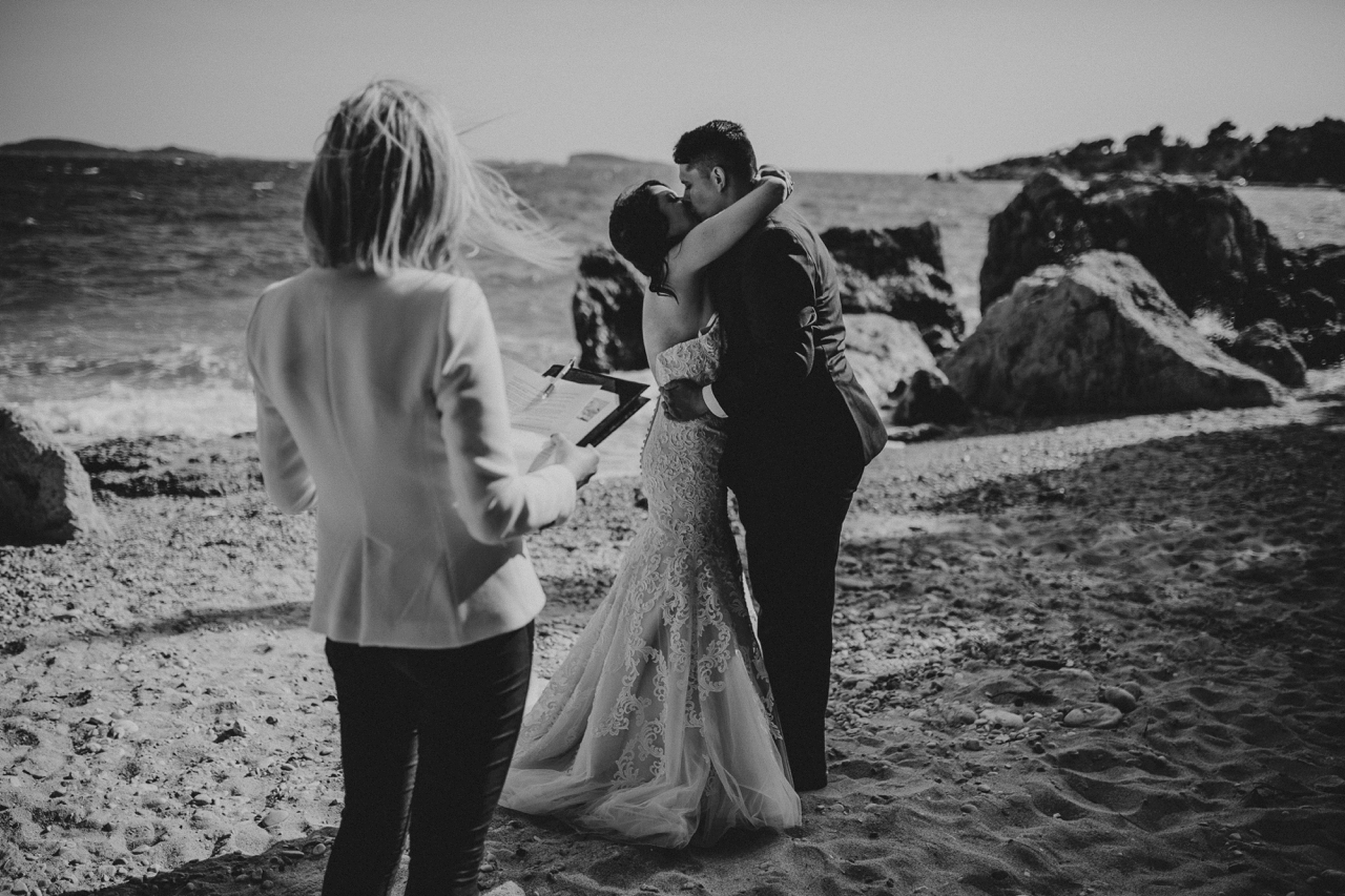 dubrovnik beach wedding newlyweds kiss