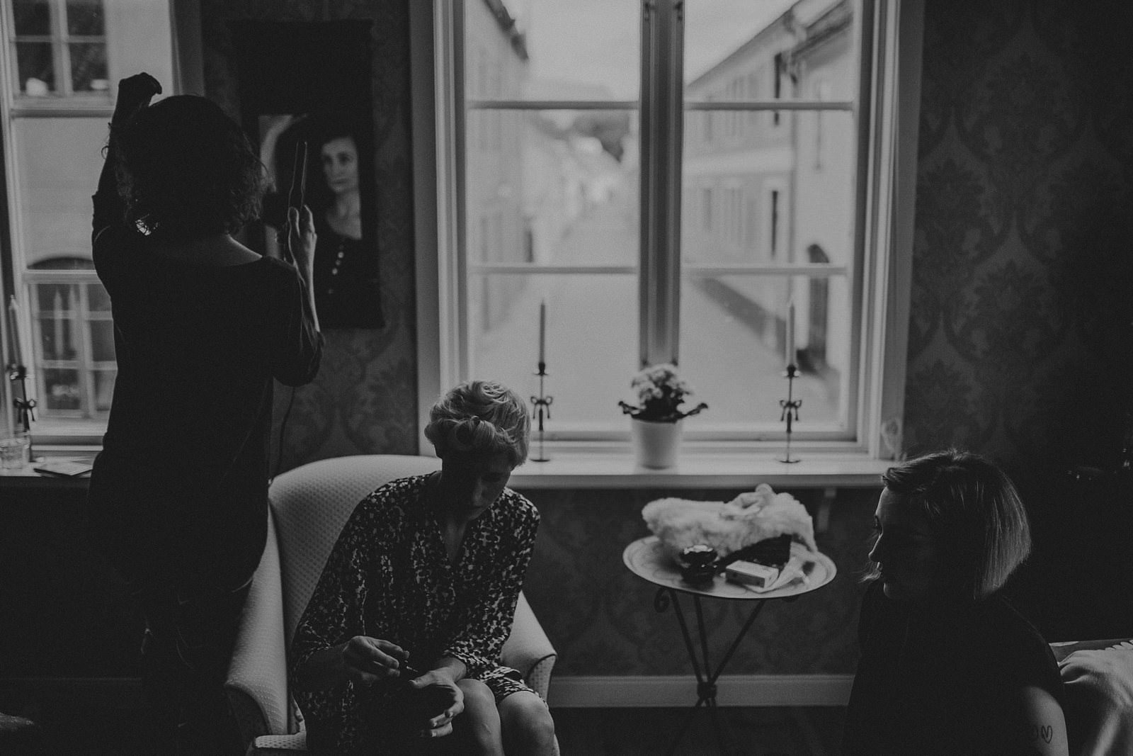 bride getting ready in rustic house in Vadstena