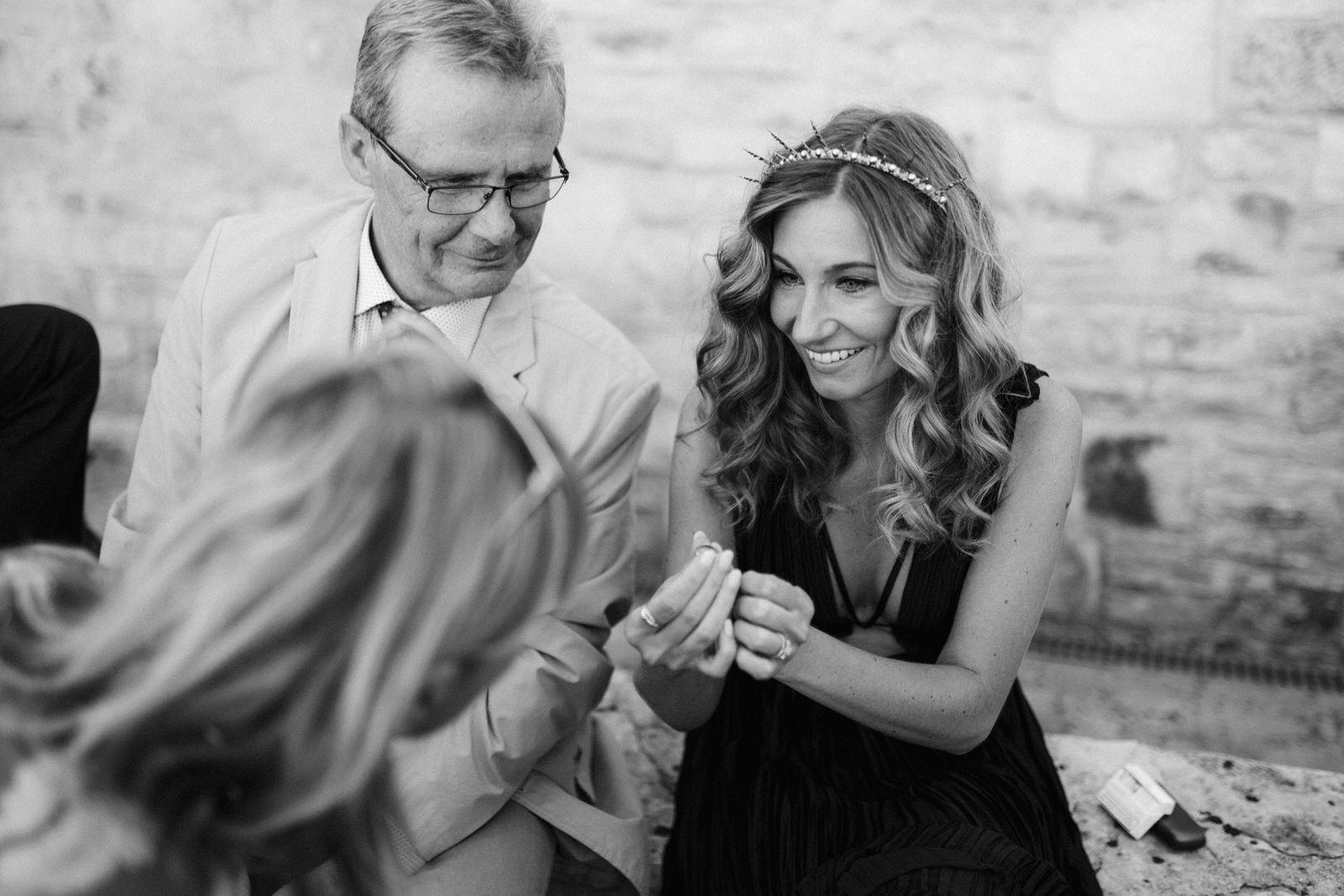 bride showing her ring to her father in law