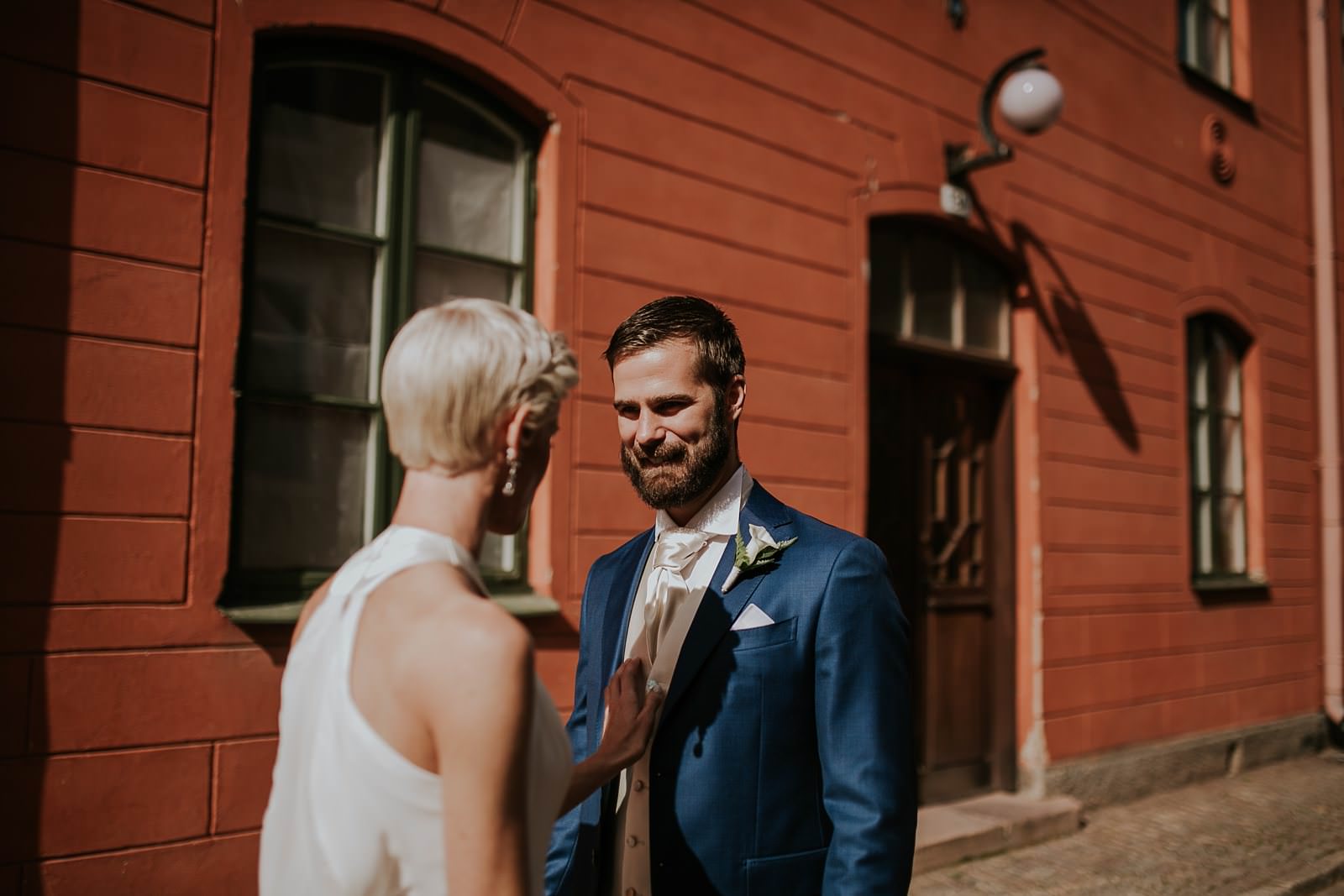 bride and groom first look in street of Vadstena, Sweden