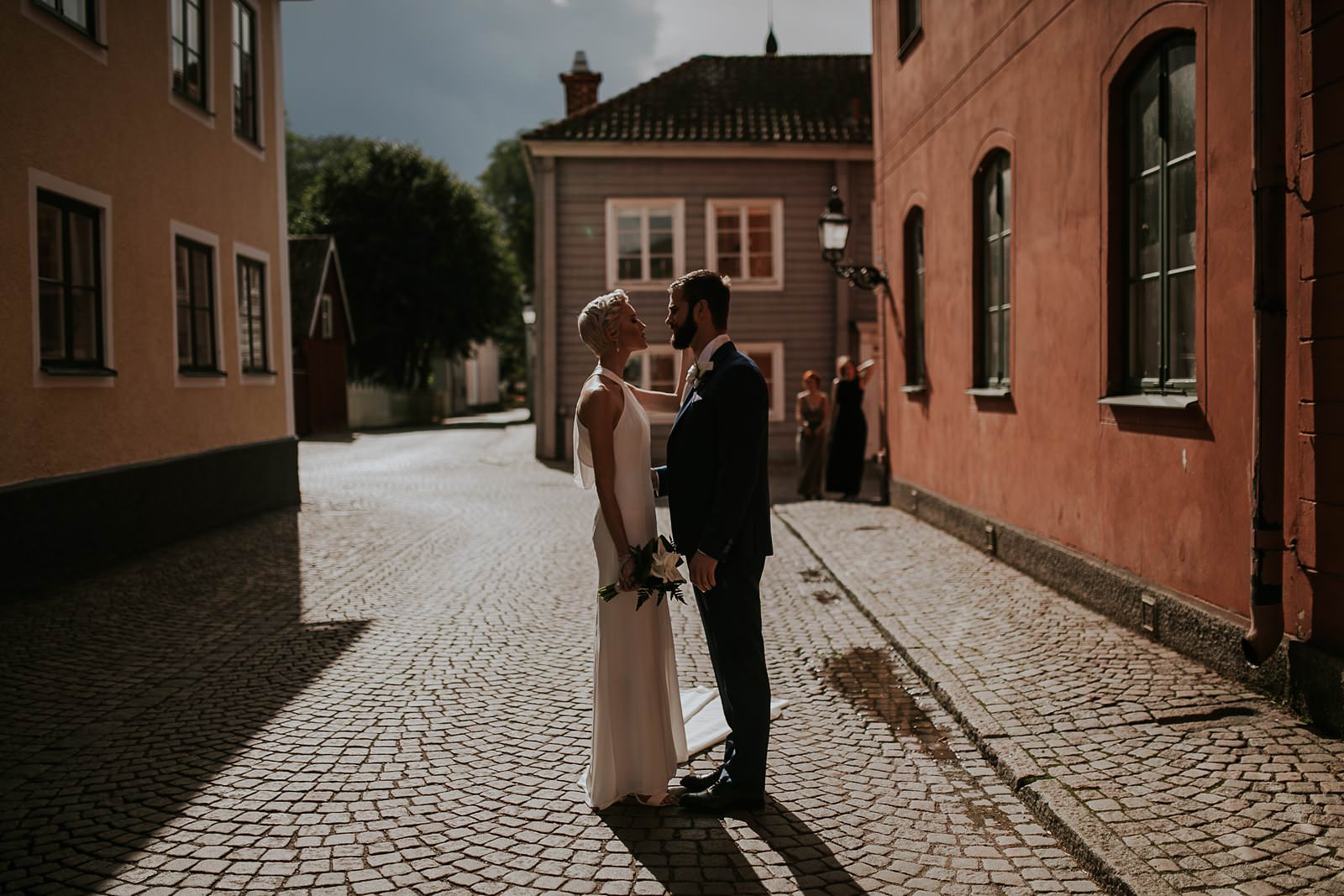 bride and groom first look in street of Vadstena, Sweden