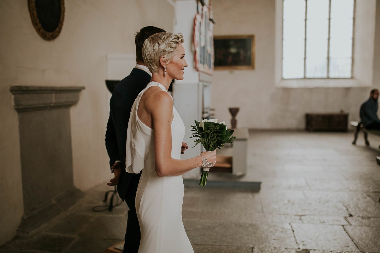wedding ceremony in Vadstena castle, bride and groom entering