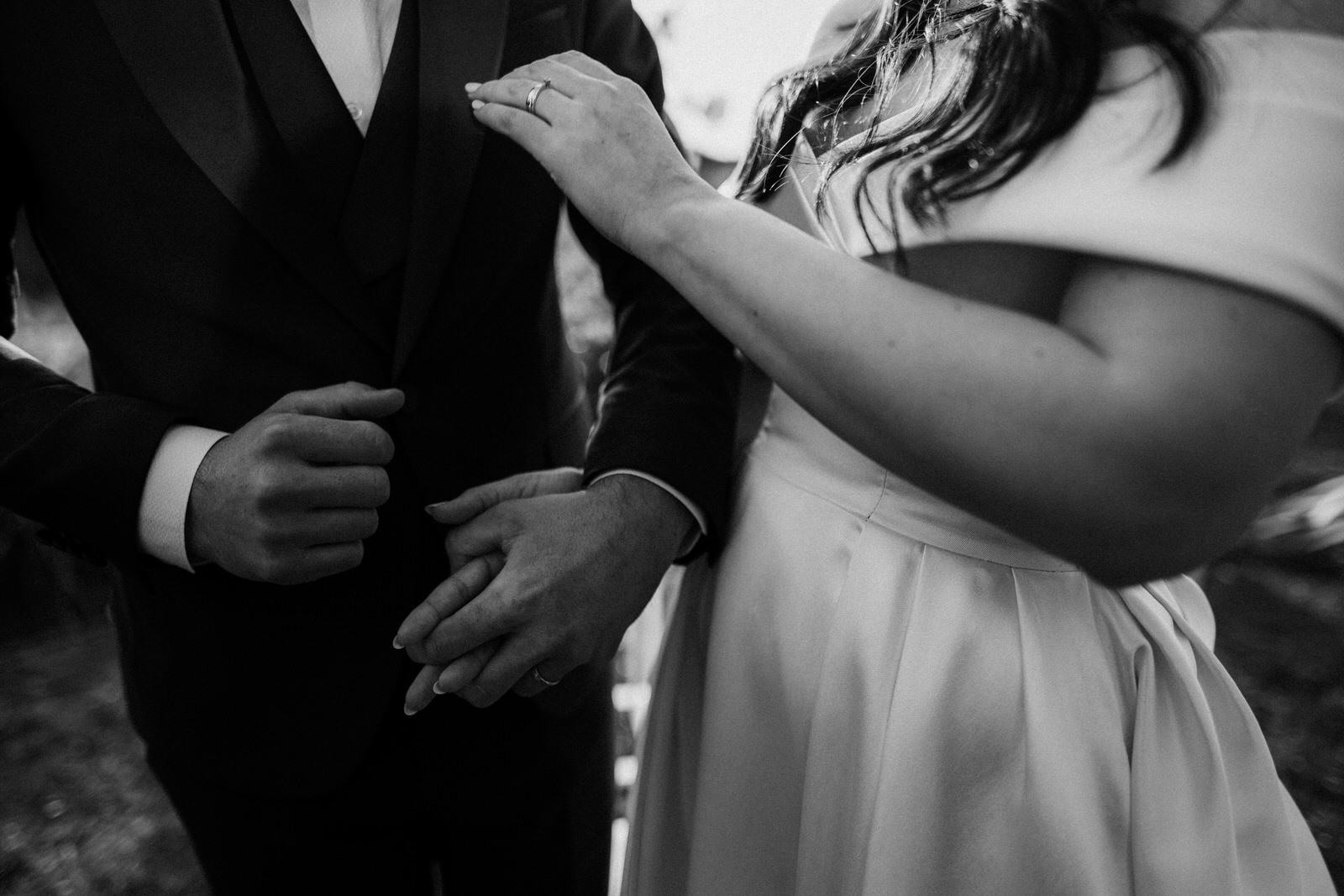 a spontaneous photo of hands holding at a wedding