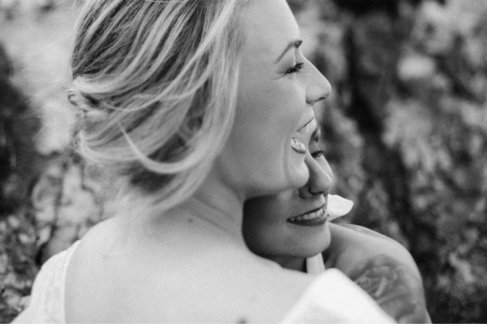 moment of laughter between two brides